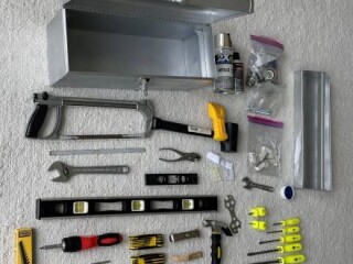 complete-set-of-tools-screwdrivers-hammer-hacksaw-wrenches